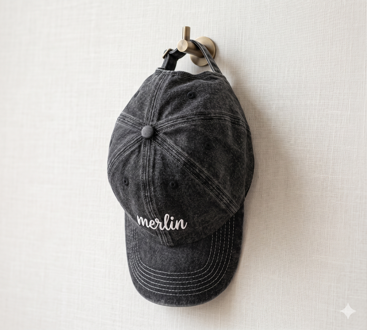Merlin Fashion caps collection — minimalist embroidered hats in quiet luxury style