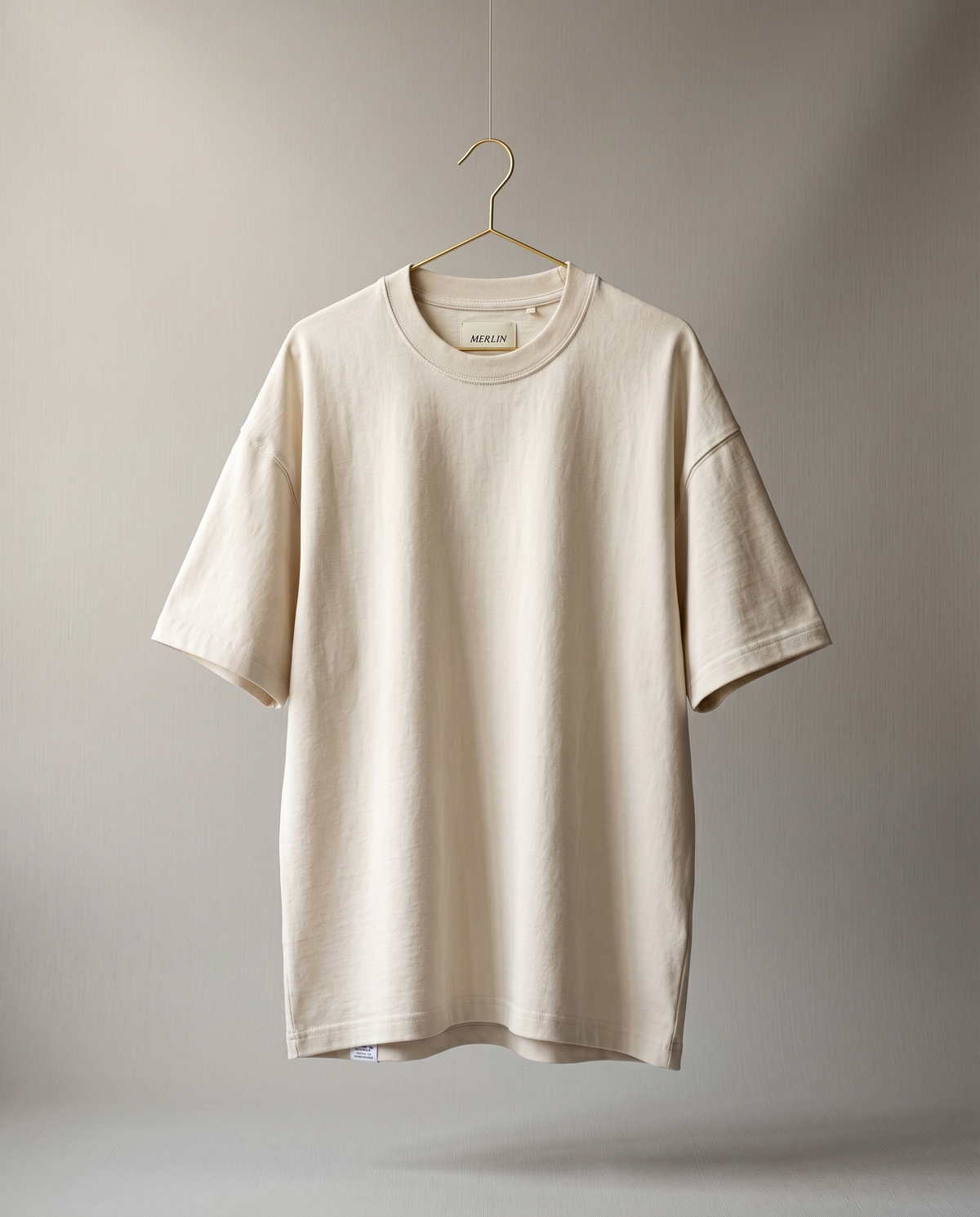 Merlin Fashion t-shirts collection — minimalist meaningful graphic tees in quiet luxury style