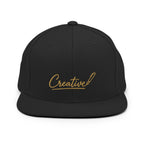 Embroidered snapback cap in gold script — Merlin Fashion