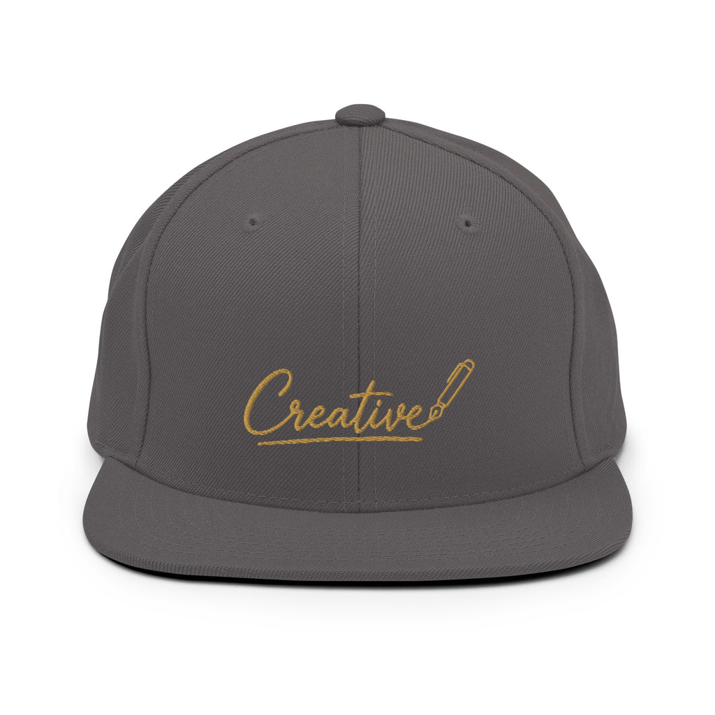 Embroidered snapback cap in gold script — Merlin Fashion