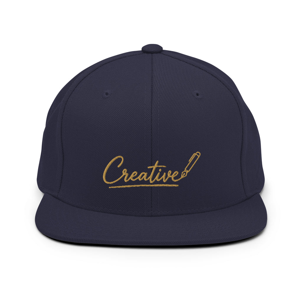 Embroidered snapback cap in gold script — Merlin Fashion