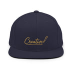 Embroidered snapback cap in gold script — Merlin Fashion