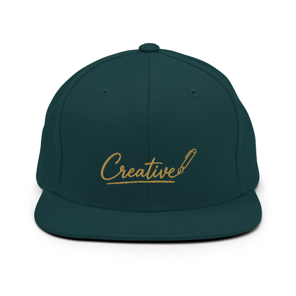 Embroidered snapback cap in gold script — Merlin Fashion