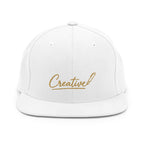 Embroidered snapback cap in gold script — Merlin Fashion