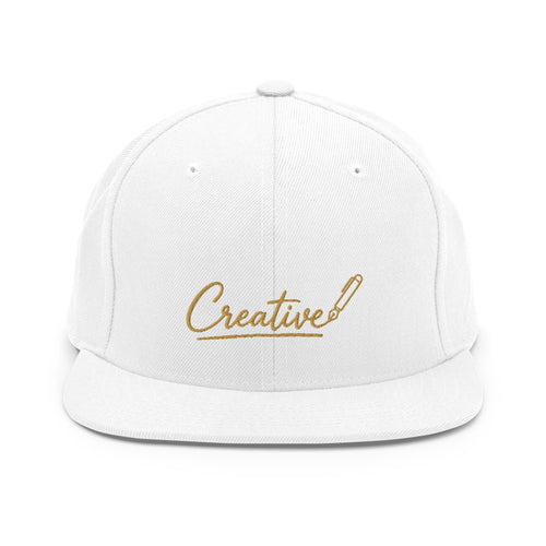 Embroidered snapback cap in gold script — Merlin Fashion