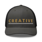 Embroidered trucker hat with gold lettering — Merlin Fashion